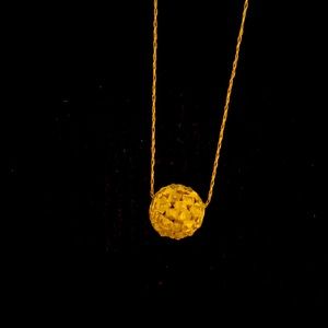 Gold necklace with gold chain ball charm